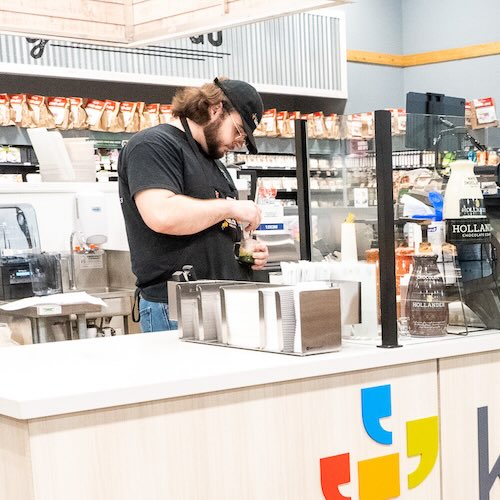 Barista preparing a drink at Klatch Coffee Eastvale