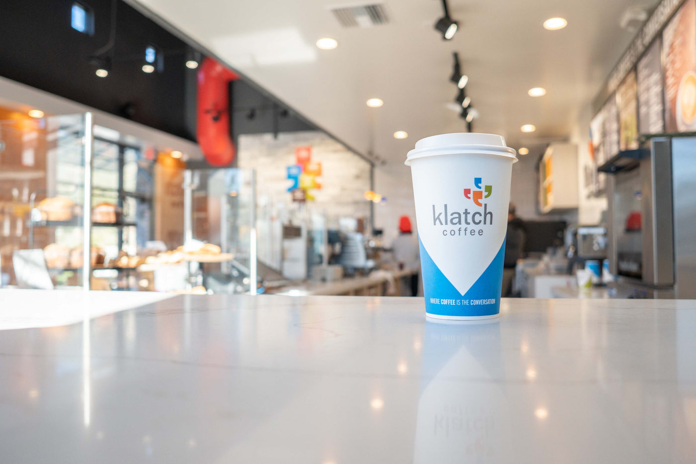 Photograph of a cup of Klatch Coffee on a countertop