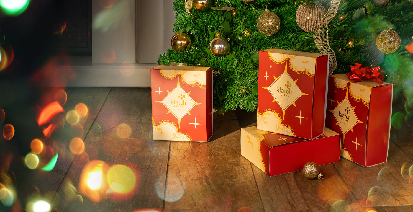 Coffee trio gift sets under a tree.